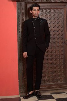 Black full sleeves bandhgala with Cosmo ray embroidery. Paired with a trouser. - Aza Fashions Formal Sets With Mirror Work In Traditional Drape, Formal Sets With Mirror Work And Traditional Drape, Elegant Festive Bandhgala With Mirror Work, Bollywood Style Formal Sets With Mirror Work, Black Bollywood Bandhgala For Ceremonial Occasions, Bollywood Style Sets With Mirror Work For Formal Occasions, Bollywood Formal Sets With Mirror Work, Formal Bollywood Sets With Mirror Work, Black Bandhgala For Ceremonial Occasions And Festivals