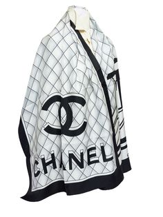 Chanel black and white silk scarf. On the scarf are the Chanel letters printed in 3D. The trim is black and has rolled edges. It is brand new. Classic White Silk Scarf, White Classic Silk Scarf, Luxury Black Silk Scarves, Luxury White Silk Scarves, Designer White Silk Scarves, White Silk Scarf, Chanel Scarf, Chanel Black And White, Hermes Handbags