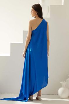 Cobalt blue one-shoulder maxi dress in modal base. - Aza Fashions Blue One-shoulder Maxi Dress For Summer, Blue One Shoulder Maxi Dress For Spring, Blue Asymmetrical Maxi Dress For Summer, Blue Asymmetrical Evening Maxi Dress, Chic Blue Maxi Dress With Asymmetrical Neckline, Blue Asymmetrical Maxi Dress, Blue One-shoulder Maxi Dress For Evening, One Shoulder Maxi Dress, Maxi Dress For Women