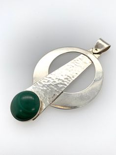 "Vintage Modernist Pendant -Unique and modern, circular pendulum design -Comprised of Sterling silver and a round bezel set malachite stone -The silver piece holding the malachite is hammered or textured, the circular piece and bail are not -Marked \"Sterling\" on the back -Bail is connected with a single pin and swivels -Larger bail to accommodate most chains, .25\" x .1\" teardrop shaped opening -Pendant measures about 2.5\" x 1.5\" -Malachite stone measures 14mm round -Total weight 9.6g -Pend Stone Settings Jewelry, Handmade Silver Jewellery, Faceted Bead Necklace, Pearl Necklace Vintage, Metalsmithing Jewelry, Metal Clay Jewelry, Modernist Jewelry, Silver Jewelry Design, Malachite Stone