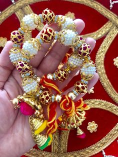 * Buyers outside UK please carefully read Dispatch and Shipping timelines 🙏 These Gana / Gaana / Gaaney comes adorned with pearl balls/trinkets/Thread balls. Ends are finished with tassels, pom poms and conical shells in Gold. Dosti Gana / Kangan symbolises deep love and solidarity between Bride/Groom and their friends. Sisters brothers and friends of Bride and Groom also tie these sacred threads around their wrists to show their active participation in the wedding functions and for showering t Traditional Pink Bracelet For Festive Occasions, Traditional Pink Bracelet For Festive Season, Traditional Pink Bracelets For Festive Occasions, Traditional Pink Bracelets For Festive Season, Pink Cutdana Bracelets For Festivals, Traditional Navratri Festival Bracelets, Bohemian Bracelets For Puja During Diwali, Bohemian Bracelets For Diwali Puja, Traditional Bracelets For Diwali Festival