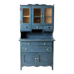 an old blue china cabinet with glass doors and knobs on the front, against a white background