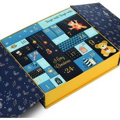 an open book with pictures and numbers on the front, blue cover has gold trim around the edges