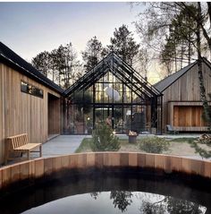 an outdoor hot tub surrounded by wooden buildings