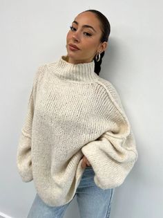 Product Description: Stay warm and stylish with our Hand Knitted Sweater. This versatile piece features an accordion-style hood and oversized fit, making it the perfect addition to your winter wardrobe. Handcrafted with love and attention to detail, this sweater showcases the skill and craftsmanship of our artisans. It is made from a luxurious blend of 38% acrylic, 12% polyamide, 38% wool, and 12% mohair, providing unmatched comfort and warmth. Designed in Italy and available in a range of beautiful colors, this hand-knit jumper is a must-have for any fashion-forward individual who values both style and quality. Highlights: - Handmade: Each sweater is meticulously crafted by skilled artisans, ensuring a unique and high-quality product. - Chunky Knit: The chunky knit design adds texture and Slouchy Chic Chunky Knit Sweater, Chic Oversized Chunky Knit Cropped Sweater, Chic Oversized Cropped Sweater In Chunky Knit, Chic Chunky Knit Relaxed Sweater, Chic Chunky Knit Sweater With Relaxed Fit, Winter Chunky Knit Relaxed Fit Top, Relaxed Fit Chunky Knit Winter Top, Oversized Chunky Knit Sweater With Batwing Sleeve, Oversized Chunky Knit Long Sleeve Top