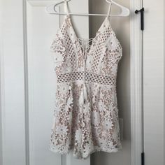 Never Worn! Cute White/Nude Lace Romper With See-Through Detail Around The Waist. Summer Lace V-neck Jumpsuits And Rompers, White Jumpsuits And Rompers For Summer Day Out, White Jumpsuit For Summer Day Out, White Jumpsuits And Rompers For Spring Vacation, White Summer Jumpsuits And Rompers For Party, Summer Lace Jumpsuits And Rompers With V-neck, White V-neck Jumpsuits And Rompers For Brunch, White Summer Party Jumpsuits And Rompers, Summer Lace Jumpsuits With V-neck