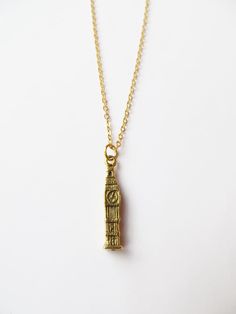 Big Ben charm necklace. The necklace is made of gold plated steel chain (45cm approx) with detailed gold pewter charm (27mm x 5mm) . It comes in an organza bag ready for gift giving. If you have any questions regarding shipping and payment, please take a look at my shop policies: http://www.etsy.com/uk/shop/LadyMangoJewellery/policy?ref=shopinfo_policies_leftnav ● Shipping: For customers in the UK your order shall arrive within a week though in most cases it's much faster, get in touch if your order is time sensitive and I will do my best to help.  For customers outside the UK, your order can take 1-4 weeks so please leave plenty of time, 80% of orders arrive within 2 weeks.  During Christmas time, please check on our shop announcement for cut-off dates. Gold-tone Brass Charm Necklace For Gift, Everyday Gold Charm Necklaces 16 Inch, Everyday Gold Charm Necklace 16 Inch, Antique Gold-plated Necklace Perfect As A Gift, Antique Gold Metal Chain Necklace As Gift, Antique Gold Metal Chain Necklace For Gift, 16 Inch Gold Plated Gold Charm Necklace, Antique Gold Necklaces With Charms For Gift, Gold Chain Necklace 16 Inch As Gift