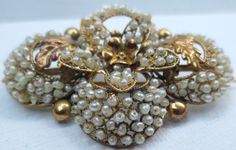 This beautiful brooch is an exquisite work of art! The finest of such an example, i've had the pleasure of offering. Dating from the late Georgian early Victorian era. Its condition is remarkable, this treasure has been well cared for. Pierced circles frame a three-dimensional flower and foliage motif. Brooch is drenched in natural seed pearls that are strung with blonde horse hair. This wedding brooch was certainly owned by someone quite wealthy. There are no hallmarks present which is common o Blonde Horse, Saddle Ring, Lavender Green, Wedding Brooch, Gold Cocktail Ring, Gold Cocktail, Circle Frames, Jade Ring, Pearl Wedding