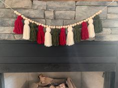 a fireplace decorated with tassels and garland