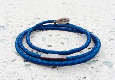 This Premium Blue Triple Wrap bracelet is Stunning. It is Hand made right in the USA and is 100% Genuine Leather. This wrap is held together with a magnetic clasp, that also twists and locks in for insured security. This wrap is a high end piece, and is the first of the Alpha Accessories Premium Collection. ( One Size Fits Most ) FREE SHIPPING Bracelet Circumference roughly 7 Inches (more or less) 100% Real Genuine Leather High quality material, and feel Hand Made in USA SHIPPING is FREE FOR USA Blue Bracelets With Stainless Steel Clasp As A Gift, Blue Jewelry With Stainless Steel Clasp For Gift, Leather Bracelet Men, Lion Bracelet, Distance Bracelets, Owl Bracelet, Triple Wrap Bracelet, Buddha Bracelets, Hamsa Bracelet