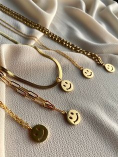 "Have a look at our shop Announcement section to avail coupon codes. https://www.etsy.com/shop/RococoLadyJewelry?ref=simple-shop-header-name&listing_id=1110983977 14k Gold Smiley Face Necklace, Gold Charm Preppy Jewelry Layering Necklaces, Happy Fun emoji Necklace, Gold Chain Necklace for Women, Jewelry ♥ Description ♥ ღ Smiley face necklace: Bring some cheer to your accessory with our cute happy face charm necklace. Features 14k gold 3 layered Snake chain necklace with a fun enamel smiley f Trendy Round Pendant Charm Necklace As Gift, Trendy Round Pendant Charm Necklace Gift, Trendy Charm Chain Necklace As Gift, Trendy Charm Chain Necklace For Gift, Trendy Chain Necklace With Charms For Gift, Trendy Chain Necklace With Round Pendant For Gifts, Fun Personalized Everyday Jewelry, Personalized Fun Everyday Jewelry, Trendy Round Charm Necklaces For Everyday