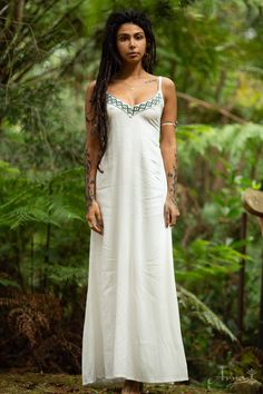 The Traditional Linen Dress is designed to feel light and breezy, made with 100% cotton, and featuring Amazonian embroidery for a unique touch of retro and Aztec style. Designed with adjustable straps and an elastic back for a comfortable and flexible fit, this eloquent dress is made for those bohemian earth-dwellers who love to embrace simple and natural beauties. Material: Linen MEASUREMENTS : Bust: 12” 31cmWaist: 14” 36cmHips: 17” 43cmLength: 49” 125cm A perfect bohemian wedding dress! Bohemi Pixie Dress, Aztec Style, Aztec Fashion, Bohemian Wedding Dress, Open Back Dresses, Wholesale Dress, Made Clothing, Bohemian Clothes, Vintage Bohemian