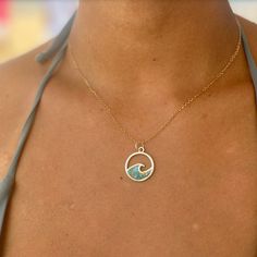 A plastic-y spin on the popular wave necklace! The Biscayne Bay Necklace elevates your style while championing sustainability. This unique piece blends ocean-inspired design and eco-consciousness. The pendant's wave shape is filled with a mosaic of upcycled microplastics. Suspended from a sterling silver chain, the necklace rests comfortably against your skin, serving as a tangible commitment to a cleaner planet. Along with looking beautiful, it's a conversation starter, a symbol of change, and Cheap Green Ocean-inspired Jewelry, Symbol Of Change, Ocean Outfits, Wave Jewelry, Ocean Necklace, Beach Stuff, Wave Necklace, Beach Necklaces, Ocean Jewelry