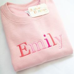 Personalised Crewneck sweatshirt with mix of pink colours  - Custom Name or Message 🌈Description: Celebrate your child's unique style with our personalised kids' t-shirt featuring vibrant rainbow colors! This shirt is the perfect addition to any child's wardrobe, and it can be customized with your child's name or a special message. 🌈Product Details: Size Options: Available in sizes from 1-2 up to 12-13 years   Colour: 12 jumper colour options with colourful pink tones embroidered text Personal Personalized Pink Crew Neck Sweater, Pink Long Sleeve Sweatshirt With Name Print, Personalized Pink Crew Neck Sweatshirt, Personalized Pink Long Sleeve Sweater, Personalized Pink Casual Sweatshirt, Pink Crew Neck Sweatshirt With Letter Embroidery, Pink Cotton Sweater With Letter Embroidery, Pink Crew Neck Sweater With Embroidered Text, Customizable Pink Cotton Sweatshirt