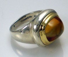 Authentic Tiffany & Co. Rare Huge Vintage Paloma Picasso Sterling Silver & 18k Yellow Gold Loaf Shape Citrine Statement Ring. This lovely size 5 ring  is fully engraved: Tiffany & Co 925 750 and signed: Paloma Picasso. It weighs 10.35 grams. The huge loaf shape golden yellow citrine is absolutely stunning. It is in excellent condition and 100 % authentic. Perfect for a collector. Please visit my ebay store for unique estate jewelry. Thank you. Paloma Picasso Jewelry, Picasso Jewelry, Paloma Picasso, Yellow Citrine, Citrine Ring, Golden Yellow, Paloma, Estate Jewelry, Statement Ring