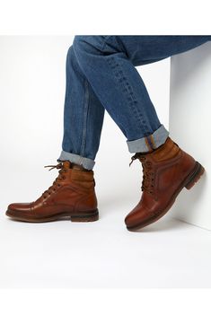 This smart lace-up boot combines the utilitarian treaded sole and cushioned heel of a traditional hiker style with the sophistication of a cap-toe derby. Leather upper/synthetic lining and sole Made in Portugal Luxury Classic Chukka Boots For Workwear, Luxury Casual Chukka Boots With Wingtip, Mens Leather Boots With Jeans, Mens Tan Casual Boots, Mens Brown Boots With Jeans, Men's Leather Boots Nordstrom, Mens Leather Lace Up Boots, Rugged Lace-up Cap Toe Boots With Reinforced Toe, Casual Winter Cap Toe Boots