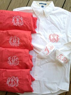 three red and white shirts with monogrammed letters on them