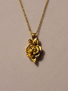 Gold Rose Cremation Urn Necklace comes on a 20 inch gold stainless steel chain.  ** This necklace is also available in silver. We provide you with everything needed to help you get the ashes into the urn.  Both urn and chain are stainless steel.  If you would like to personalize this necklace,  please go to our "ADD ON" section.  There you will find birthstones, initials and much more that you could add to this bracelet to personalize it. Please feel free to message us with any questions you may have.  Thank you so much! Rose Urn Necklace For Ashes, Gold Flower Pendant Jewelry With Roses, Gold Jewelry With Rose Flower Pendant, Gold Jewelry With Rose Details As Flower Pendant, Gold Jewelry With Rose Details In Flower Pendant Shape, Gold Necklaces With Rose Flower Pendant, Gold Necklaces With Roses For Anniversary, Gold Jewelry With Roses For Gift, Gold Roses Jewelry For Gift