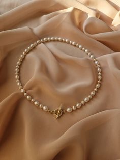 Introducing our dainty pearl necklace - perfect blend of classic elegance with modern touch. This real pearl choker, featuring a gold plated toggle clasp, adorned with moissanite stones,  that add sophistication and charm, making this pearl necklace an ideal for the most important occasions of your life. DETAILS ♦️ Material - 18-karat gold plated premium quality brass ♦️ Real freshwater pearls ♦️ Toggle clasp adorned with dazzling cubic zirconia stones ♦️ Standard size (on the model on the photo Pearl Necklace Clasp, Elegant Gold Single Strand Bridal Necklace, Elegant Single Strand Gold Bridal Necklace, Gold Single Strand Pearl Necklace For Wedding, Pearl White Clavicle Chain Pearl Necklace For Anniversary, Vintage Clavicle Chain Jewelry For Wedding, Anniversary Clavicle Chain Pearl Necklace, Elegant Pearl Bridal Necklace With Clavicle Chain, Elegant Pearl White Bridal Necklace With Clavicle Chain