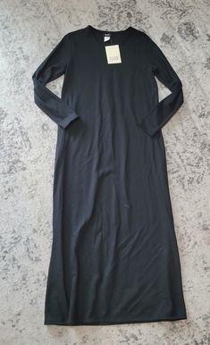 Brand: Eileen Fisher Color: Black Material: Wool Size: S Condition: Nwt Please Confirm Style Name With Photos Above Black Stretch Longline Maxi Dress, Black Longline Dress For Spring, Black Longline Dresses For Spring, Black Longline Party Dress, Black Longline Daywear Dress, Black Longline Dress For Daywear, Black Long Daywear Dresses, Long Black Daywear Dress, Elegant Longline Black Dress