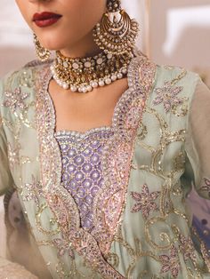 Luxury Mint Green Gown Style Lilac Sharara Pakistani Wedding Dress is a beautifully embroidered shirt is rendered in soft peach with thread and sequin detailing and paired with a ruffled dupatta and lace bordered trousers this chic and versatile formal will take you easily from daytime occasions to evening festivity. Embroidered Kameez: The perfectly crafted Pakistani Wedding Dress is adorned with intricate embroidery on the front, and sleeves making the elegant design. The neckline and sleeves Lilac Sharara, Mint Green Gown, Mint Gown, Pakistani Boutique, Pakistani Designer Clothes, Green Formal Dresses, Pakistani Wedding Dress, Unstitched Dress Material, Gown Style