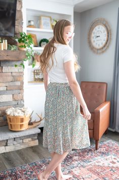 This is a skirt that falls below the knee and features pleats and a floral pattern. If you are wanting a skirt that evokes a sense of joy and movement as the seasons change from winter to spring this is it! This is a fun and trendy skirt with a floral pattern which might be the perfect addition to your wardrobe!