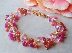 Elegant, Opulent and Shimmery. This gorgeous gemstones cluster bracelet is jam-packed with clusters of various sized Hot pink quartz,rose quartz and citrine gemstones. Nine beautiful faceted Swarovski blush rose crystals in the center. The bracelet is adjustable from 7" to 8" and is finished with a secure gold lobster claw clasp. This stunning cluster bracelet is unique, feminine and eye-catching, Perfect for anyone that wants to make a statement or to wear to a special occasion! Also available Wedding Beaded Bracelet With Gemstone Beads, Elegant Pink Faceted Crystal Bracelet, Faceted Pink Jewelry For Wedding, Elegant Pink Crystal Bracelet With Colorful Beads, Pink Faceted Wedding Jewelry, Pink Skirt Set, Cluster Bracelet, Pink Jade, Rose Crystal