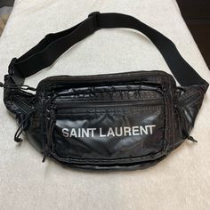 Very Good Condition With Minimal Signs Of Wear. Has Some Faint Marks/Stains On The Back And On The Top Of The Bag, No Dust Bag. Length: 9.8” Height: 6.6” Depth: 3.5” Yves Saint Laurent Belt Bag, Bags Ysl, Crossbody Belt Bag, Ysl Saint Laurent, Nylon Crossbody Bag, Saint Laurent Bags, Black Crossbody, Saint Laurent Bag, Black Nylon