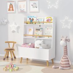 a white book shelf with stuffed animals on it in a child's playroom