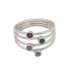 A rainbow of petite gemstones sparkle at the center of this carefully crafted ring from Bali's Ketut Sulastri. Joined at the base of the ring a quartet of sterling silver bands separate into distinct pieces at the ring's top. Each band holds a different gemstone--amethyst quartz garnet and zircon--in a bezel setting. Amethyst And Garnet, Silver Bands, Multi Gemstone Ring, Amethyst Quartz, Garnet Rings, Sterling Silver Bands, A Rainbow, Bezel Setting, Garnet