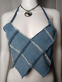 Retro cropped denim festival V-neck  halter with patchwork style, raw edges, pixie points and adjustable neck and waist ties.One Size1 of 1 Trendy Summer Patchwork Crop Top, Trendy Spring Patchwork Crop Top, Spring Trendy Patchwork Crop Top, Summer Cropped Top With Frayed Hem, Summer Cropped Crop Top With Frayed Hem, Summer Crop Top With Frayed Hem, Blue Denim Patchwork Top For Summer, Summer Denim Top With Patchwork, Fitted Patchwork Crop Top For Spring