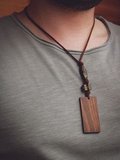 Hippie Long Necklace With Wood Pendant * Perfect gift idea for men * Boho/Minimalist Fashion * Handmade and natural Length of pendant: 5 1/2 cm Handmade Dog Tag Necklace For Gift, Handmade Pendant Necklace For Father's Day, Brown Waxed Cord Necklace For Gift, Personalized Brown Necklace For Gift, Rustic Jewelry With Adjustable Cord For Gift, Minimalist Brown Necklaces For Gifts, Minimalist Brown Necklace For Gifts, Brown Jewelry Gift For Father's Day, Minimalist Brown Necklace For Gift