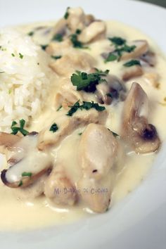 a white plate topped with rice and mushrooms