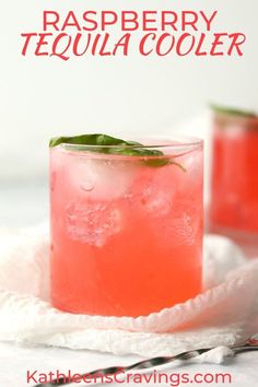 raspberry tequila cooler with basil garnish on the rim and in a glass