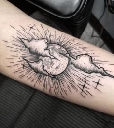 a black and white photo of a sun with clouds on it's arm, done by