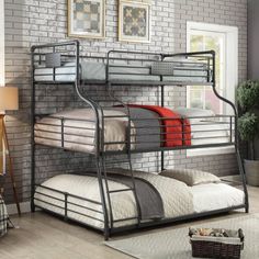 a metal bunk bed sitting next to a brick wall in a room with a rug on the floor