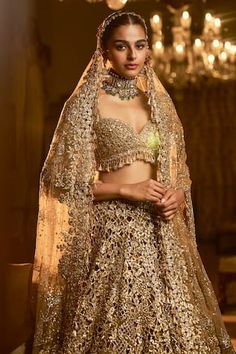 Gold attached cancan lehenga with zardozi, sequin, thread embroidery in floral cutwork pattern. Paired with padded blouse with pearl tassel on sleeve hem. Comes with tassel border embroidered dupatta. - Aza Fashions Anarkali Lace Work Wedding Sets, Anarkali Wedding Set With Lace Work, Semi-stitched Lace Work Lehenga For Festivals, Fitted Lehenga With Lace Work For Festive Occasions, Wedding Sharara With Lace Work For Festivals, Lace Work Sharara For Wedding And Navratri, Wedding Sharara With Lace Work For Navratri, Elegant Lace Work Lehenga For Festivals, Festive Sets With Lace Work And Traditional Drape