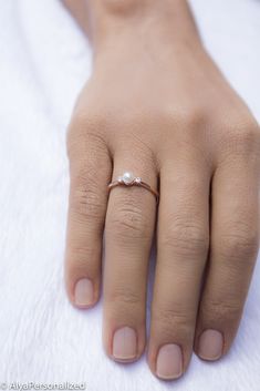 Unique engagement ring with a pearl and diamond... Elagant & unique gift for speacial women ♡ ► FEATURES; Gemstones: Akoya Pearl: 4mm Diamond: 2*2mm (Color G; clarity VS) Material Options: 14k Rose Gold, 14k Yellow Gold, 14k White Gold Size: All ring sizes are available ► HOW TO ORDER; Please select your preffered size and material from the menu while adding to card. ► PROCESSING & SHIPPING ❥We ship to worlwide, please check current delivery times depending on your location at the bottom Diamond Solitaire Pearl Ring Gift, Fine Jewelry Pearl Ring With Single Diamond For Wedding, Minimalist Diamond Pearl Ring As Gift, Pearl Ring With Single Diamond - Gift, Elegant Rose Gold Pearl Ring As A Gift, Elegant Rose Gold Pearl Ring Gift, Wedding Pearl Ring With Rose Cut Diamonds, Pearl Rings With Diamond Accents For Gift, Delicate Rose Gold Pearl Ring For Anniversary