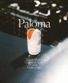 the cover of paloma magazine features an orange slice in a tall glass with ice