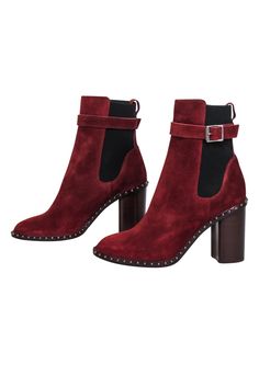 Step up your fall fashion game with these Rag & Bone rust red suede boots! The studded trim and buckle detail add a touch of edginess to this autumn gem. Perfect for adding a pop of color and style to any fall outfit! Size 8 (IT 38) Made in Italy 100% Suede upper Leather lining and sole Buckle detail Stud trim Elastic side panels Heel height 4" Shaft 6.5" Fall Suede Boots With Studs, Studded Suede Boots For Fall, Burgundy Boots With Reinforced Heel For Fall, Fall Burgundy Heeled Boots With Reinforced Heel, Red Heeled Boots For Workwear In Fall, Red Heeled Boots For Work In Fall, Red Suede Boots, Goth Prom, Red Leather Boots