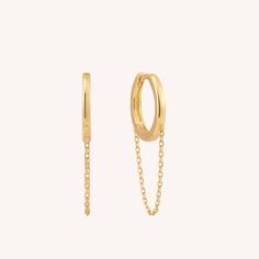 Discover the charm of the 14K Solid Gold Chain Huggie Earrings, designed to make a statement and add a playful touch to your ensemble. Whether it's day or night, showcase your individuality by wearing them paired or single. Material14 Karat Solid Gold.Nickel free. Suitable for sensitive skin. Quantity & MeasurementOne pair of Chain Huggie EarringsGauge: 20G (0.8mm)Inner diameter: 8mm Outer diameter: 11mm Chain Length: 30mmEst. Gold Weight: 1.30g *Earrings for layering purposes only. Sold separately. Opal Birthstone, White Gold Chain, Luxury Earrings, Solid Gold Chains, White Gold Chains, Solid Gold Earrings, Luxury Necklace, Gauged Earrings, Yellow Gold Chain