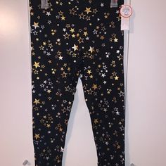 These Leggings Are A Size Xl For Girls, Which Is A Size 14/16. They Are Black With Various Sizes Of Gold And Silver Shimmery Stars That Cover The Front And Back Of The Leggings. They Are Made Of Tough Cotton And Are Very Durable. These Are Brand New With The Original Tags And Are In Excellent Condition. Size Girls Xl Star Leggings, Glam Room, Happy Pride, Pride Month, Silver Stars, Kids Bottoms, Gold And Silver, Colorful Leggings, For Girls