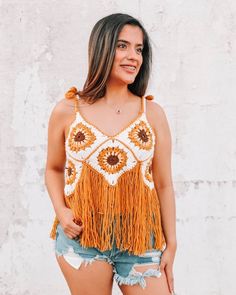 The Sunflower Fringe Crochet Top is the perfect boho cottage core girl piece! Layer it over a bralette for the coolest boho chic look!  It features a cropped fit on the crocheted sunflower portion, and the fringe will hit below the belly button. It's such a one-of-a-kind unique piece for your wardrobe.   This piece is handmade with obscene amounts of love, so sizing and color placement will vary slightly. In terms of sizing, this piece will comfortably fit S-XL, as it has an adjustable tie in the back! We recommend hand washing and hanging to dry! Boho crochet top | boho style crochet clothing | cottage core apparel Festival Outfits Country, Cottage Core Girl, Crocheted Sunflower, Boho Sunflower, Boho Cottage Core, Fringe Crochet, Sunflower Crochet, Crochet Boho Top, Boho Cottage