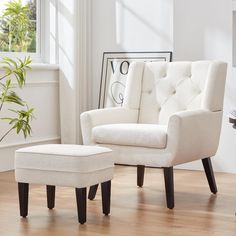 a white chair and ottoman in a room