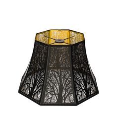 a black lamp shade with trees on the bottom and yellow lining around the lampshade