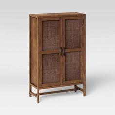 a wooden cabinet with wicker doors on the front and bottom, against a white background