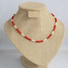 Individually crafted with care, this handmade traditional Indian necklace features a combination of coral beads and pearls that provides an elegant aesthetic with a beautiful, natural color, complementing any skin tone. Measuring 18 inches in length, this unique piece showcases the artistry of 3mm Italian coral and pearls. The single line of coral beads adds a touch of chicness, making it versatile enough to pair with various outfits. Additionally, I've designed another necklace with even more I Hand-strung Pearl Necklace For Gift, Elegant Beaded Red Coral Pearl Necklace, Elegant Red Coral Beaded Pearl Necklace, Orange Red Coral Beaded Necklaces Hand-strung, Handmade Elegant Red Coral Pearl Necklace, Traditional Pearl Necklaces With Colorful Beads, Hand-strung Red Coral Beaded Necklaces As Gift, Hand-strung Red Coral Beaded Necklace For Gifts, Spiritual Beaded Red Coral Necklaces