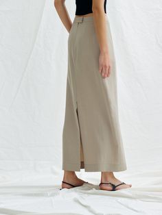 Editor's NotesThis is a chic mood maxi skirt. It is an attractive item with a vintage color feeling made of washed tencel material in a minimalistic design.- Creates a feminine silhouette with high waist and H-line.- It is natural and stylish with a falling texture.- Skirts with side pockets, covered button on the back and zipper closure- There is a back opening to add activity*The color of the image may differ from the actual color depending on the resolution of your monitor.Measurements (inch) Beige Maxi Length Spring Bottoms, Beige Maxi Length Bottoms For Spring, Elegant Long Skirt With Relaxed Fit, Chic Long Skirt In Neutral Color, Summer Wide Leg Maxi Skirt For Daywear, Chic Neutral Long Skirt, Beige Maxi Length Lined Skirt Bottoms, Beige Midi Length Bottoms For Daywear, Spring Workwear Maxi Skirt Full Length