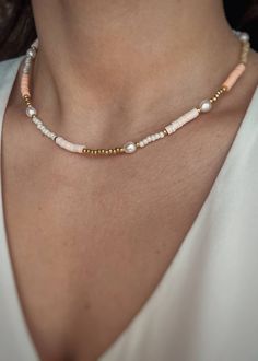 Necklace made of Katsuki beads, Toho beads and Natural Pearls. Clasp made of gold-plated sterling silver Length: 38, 40, 42, 45 or 50 cm. The size of the beads: approx. 2-4 mm. A perfect holiday necklace! A combination of Katsuki beads in beautiful light orange and cream colors, Toho beads in white and gold and Natural Pearls. The perfect idea for a holiday accessory. It will blend in beautifully with holiday stylizations and bathing suits. Vivid colors are currently incredibly fashionable, they add character and charm. The necklace also has a 3 cm extension. It is possible to make any size on request. Jewelry With Clay Beads, Beaded Bracelets And Necklaces, Beaded Necklace Layering, Orange Beads Necklace, Dainty Gold Heishi Beads Jewelry, Gold Heishi Beads Jewelry, Gold Heishi Beads For Gift, Gold Beaded Necklaces With Colorful Beads For Everyday, Gold Heishi Beaded Chain Jewelry