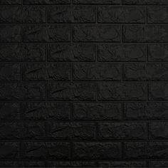 a black brick wall that is very dark